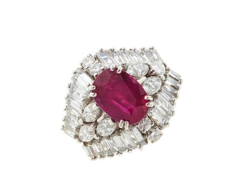 An 18ct gold ruby and diamond cluster dress ring, with marquise-shape diamond sides and vari-cut diamond border, ruby estimat