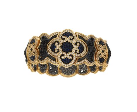 Dimitrios Kapsaskis, a 22ct gold plated and silver, blue gem and cubic zirconia Pomegranate bracelet, with partially conceale