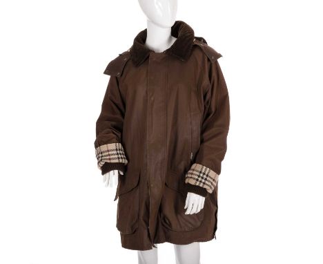 Burberry, a men's coat, designed with a brown waxed cotton outer shell, featuring a detachable hood, button and zip front fas