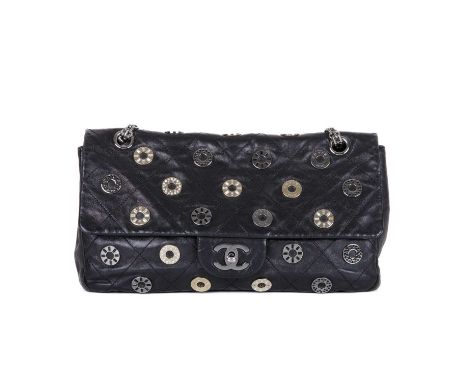 Chanel, a Star Attitude Flap handbag, featuring a diamond quilted black leather exterior adorned with embellished grommets th
