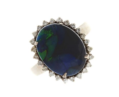 A mid 20th century 18ct gold black opal doublet and single-cut diamond cluster ring, estimated total diamond weight 0.20ct, s