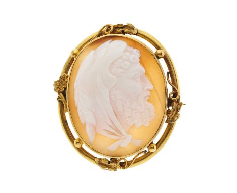 A late Victorian yellow metal shell cameo brooch, carved to depict Hercules in profile, with foliate surround, length 4.8cm, 