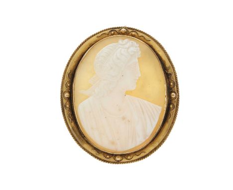 A mid to late Victorian gold shell cameo brooch, possibly carved to depict Artemis, with cannetille surround, length 4.9cm, 1