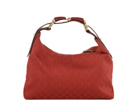 Gucci, a Horsebit hobo handbag, crafted from red GG canvas, with a wide red leather shoulder strap with large feature horsebi