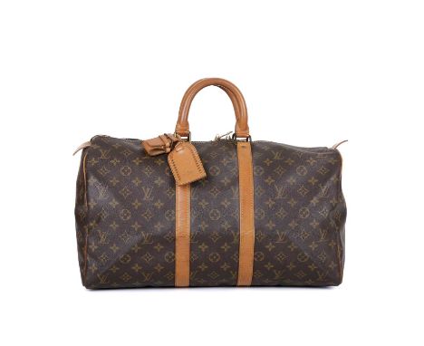 Louis Vuitton, a vintage monogram Keepall 45 luggage bag, featuring the maker's classic monogram coated canvas exterior and t