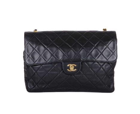 Chanel, a vintage Jumbo Single Flap handbag, featuring a black quilted leather exterior, with 24k gold plated hardware, rear 