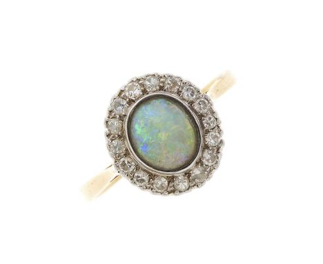 An early 20th century 18ct gold opal and single-cut diamond cluster ring, opal measures 7.6 by 6.6mm, estimated total diamond