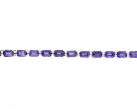 An 18ct gold amethyst line bracelet, with brilliant-cut diamond double spacers, estimated total diamond weight 0.75ct, stampe
