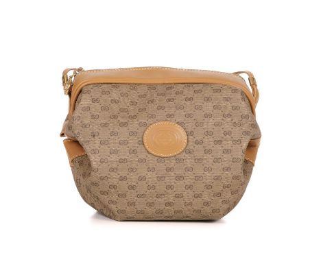 Gucci, a vintage barrel handbag, crafted from the maker's micro monogram coated canvas, with smooth tan leather trim, designe