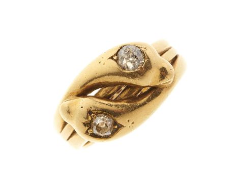 A late Victorian 18ct gold double snake ring, with old-cut diamond crest highlights and grooved band, estimated total diamond