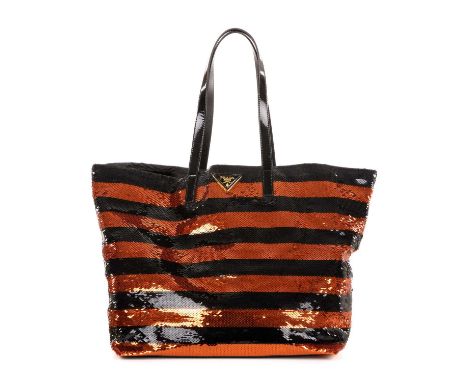 Prada, a striped sequin tote, featuring an orange and black striped sequin exterior, with black patent leather handles, an op