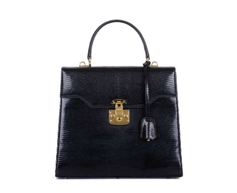 Gucci, a vintage black lizard Lady Lock handbag, designed with a black lizard leather exterior, with gold-tone hardware, rear