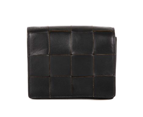 Bottega Veneta, an Intrecciato Mini Cassette crossbody bag, crafted from smooth black nappa leather, featuring the maker's si