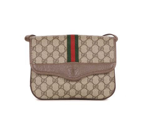 Gucci, a vintage supreme Web Flap handbag, crafted from the maker's GG coated canvas exterior with brown leather trim, featur