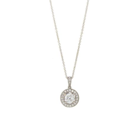An 18ct gold brilliant-cut diamond single-stone pendant, with similarly-cut diamond halo and surmount, suspended from a white