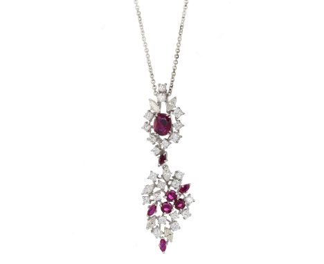 An 18ct gold vari-shape ruby and vari-cut diamond drop pendant, suspended from a white metal chain, principal ruby estimated 