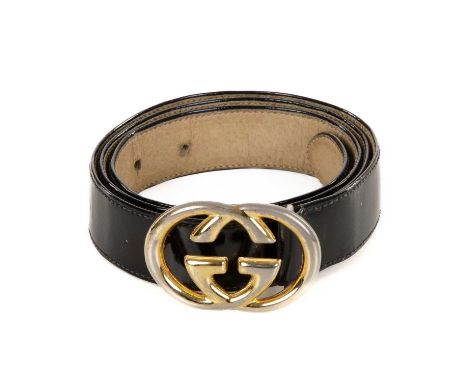 Gucci, a vintage leather belt, crafted from black patent leather, featuring an interlocking GG buckle with pin fastener, labe