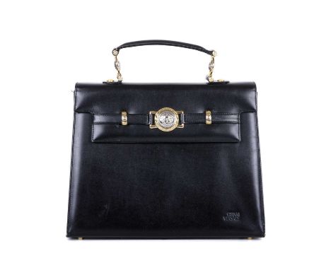 Versace, a vintage leather handbag, crafted from smooth black leather, featuring two-tone Medusa metal hardware with Greca de