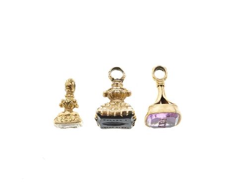 Three 19th century gem-set intaglio seal fobs, to include a mid 19th century gold amethyst monogram seal fob, gems to include