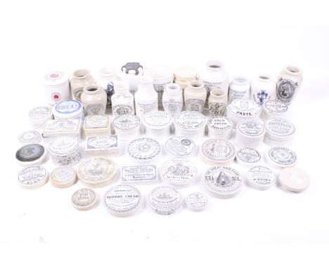 A collection of vintage pot lids and jars. Including one for 'Home Made Potted Meats' manufactured by the Army & Navy Co-oper