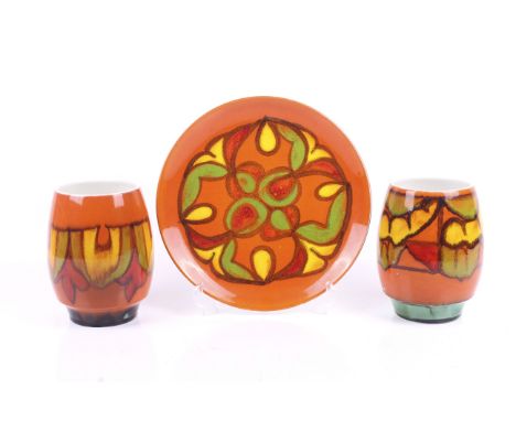 Three Poole Pottery Delphis items. Consisting of two vases #83, H16cm, and a plate 25.5cm, diameter