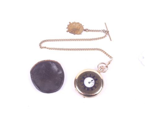 A Swiss gold plated pocket watch and a curb link watch chain hung with an National Rifle Association medallion. the pocket wa