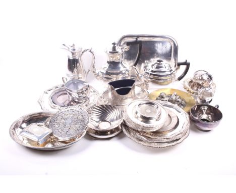 A quantity of silverplate. Including a tea and coffee service, a brass wall plaque decorated with cherubs, dishes with emboss
