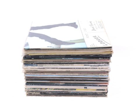 A collection of vintage LPS records. Mostly 1970s and 80s. Examples featuring David Bowie, including 'Hunky Dory', 'Lodger', 