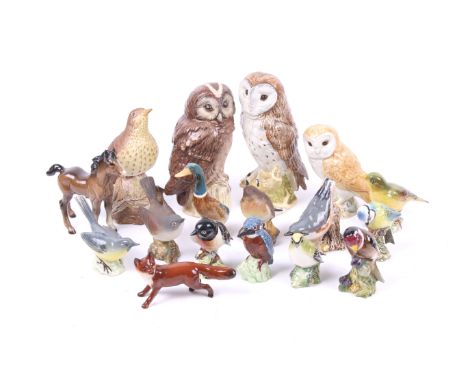 An assortment of ceramic animal figures. Including a Beswick 'Greenfinch' 2105, 'Goldfinch' 2273, a Beswick fox, pony and mor