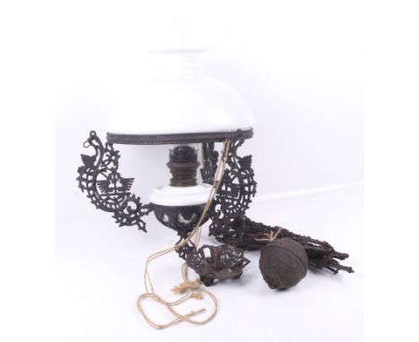 A Victorian rise and fall ceiling lamp. The case metal frame and chains having elaborate pierced and moulded decoration, the 