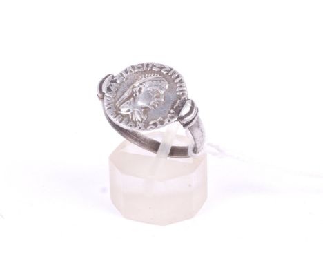 A white metal coin ring. Possibly Bactrian, with bust of a ruler, size P/Q, weight 3.6g