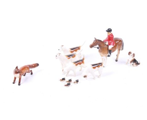 A Beswick fox and hound hunting set and other ceramic animals. Comprising a Beswick horse riser, a Beswick fox, four Beswick 