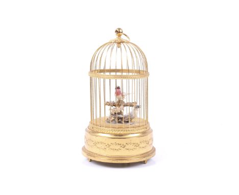 A 20th century Swiss bird cage automaton by Reuge Music. The metal frame of typical form with two singing birds, maker's mark