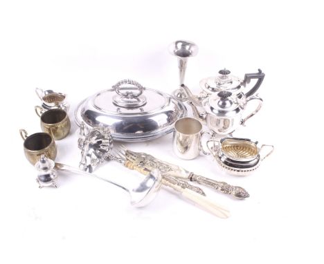 A quantity of silverplate. Including a trumpet vase, ladle, lidded dish and flatware, etc. 