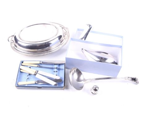 A collection of silverplate. Including a ladle, a boxed Reed & Barston dish, a shaker and more