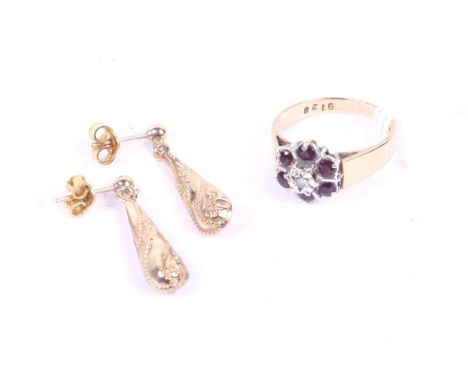 A hallmarked gold stone set ring and a pair of yellow metal earrings. Ring with indistinct marks, size M