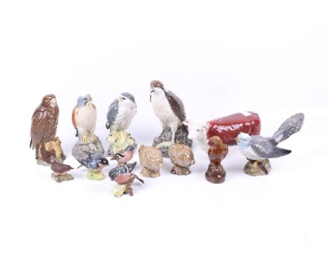 A collection of Beswick ceramic animal figures. Including 'Merlin Beneagles', 'Bullfinch' 1042, Osprey decanter and more. Max