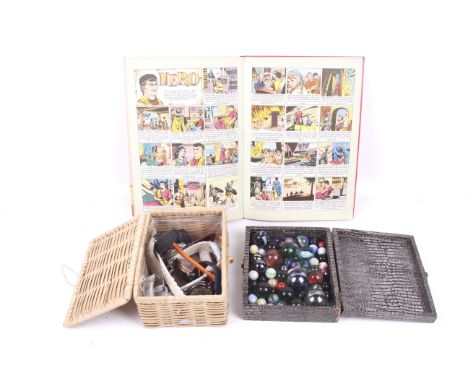 An assortment of collectables. Comprising a box of vintage German marbles, a box of men's watches and a 1960s topper annual