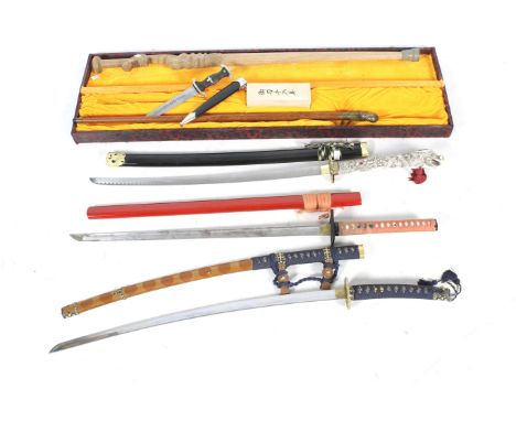 Four replica swords, a knife and a stick. Including a replica Hitler Youth dagger, an oriental sword with a carved handle and