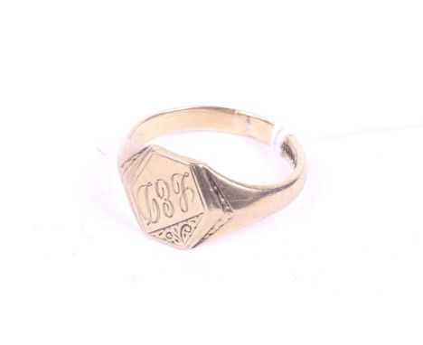 An engraved 9ct gold signet ring. Hallmarked H.S (H Samuel), 9, 375 and Birmingham. Size W/X, weight 5.7g.