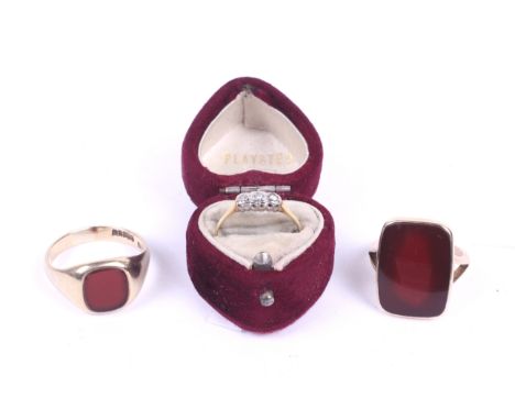 Three gold and stone set rings. Including an 18ct gold ring with three small diamonds, boxed, a 10ct large signet ring set wi