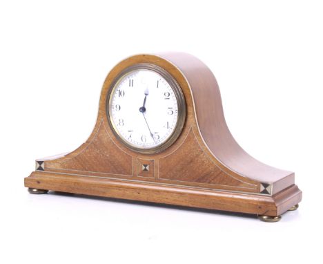 An early 20th century inlaid mahogany mantel timepiece. With white enamel dial, Arabic numerals, mechanism stamped 'France', 