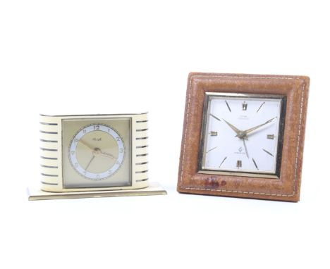 Two small vintage clocks. Including Kiengle enamel bedside alarm clock and a Cyma Amic alarm clock. Max. H8cm