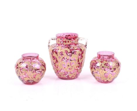 A group of three Victorian ruby glass and enamel vases. Having applied good floral and white berry decoration. Max. H11.5