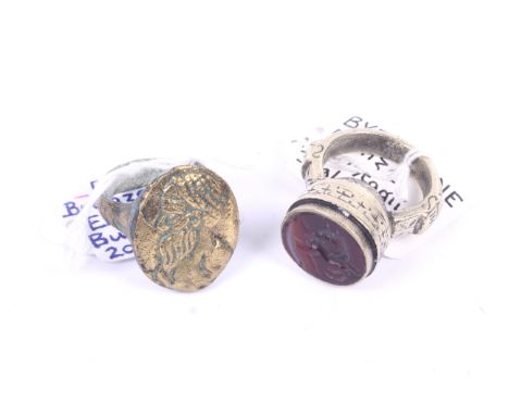 An agate intaglio seal ring and a bust ring. The first possibly Byzantine, intaglio in the form of a horse, the second possib