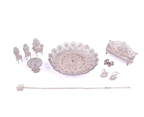 A small collection of white metal filligree items. Including doll's house furniture such as a sofa, table and chairs, earring
