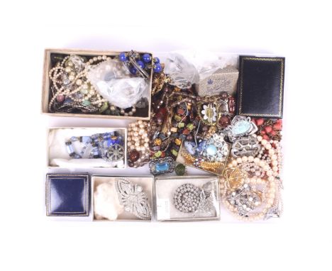 A collection of costume jewellery. Including a paste double cup in art bead style, various beaded necklaces, brooches, rings,