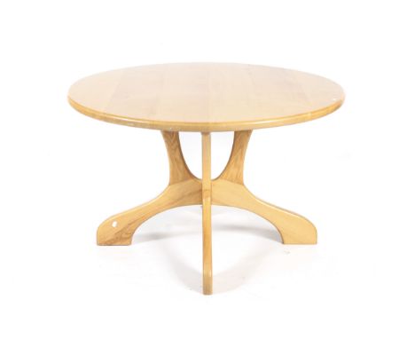 A mid-century 'Ercol' style circular dining table. With quatrefoil pedestal base. Diameter 122cm