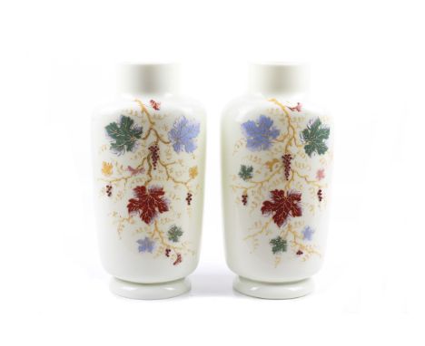 A pair of tall white milk glass vases decorated with fruiting vines. Enamel decoration and applied grapes. H30cm