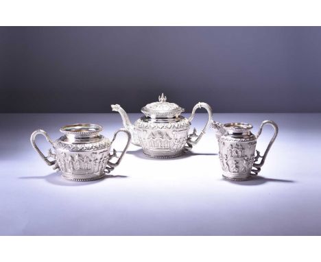 An Anglo-Indian silver three-piece tea set, circa 1880Comprising teapot, cream jug and sugar bowl, with serpent handles and s